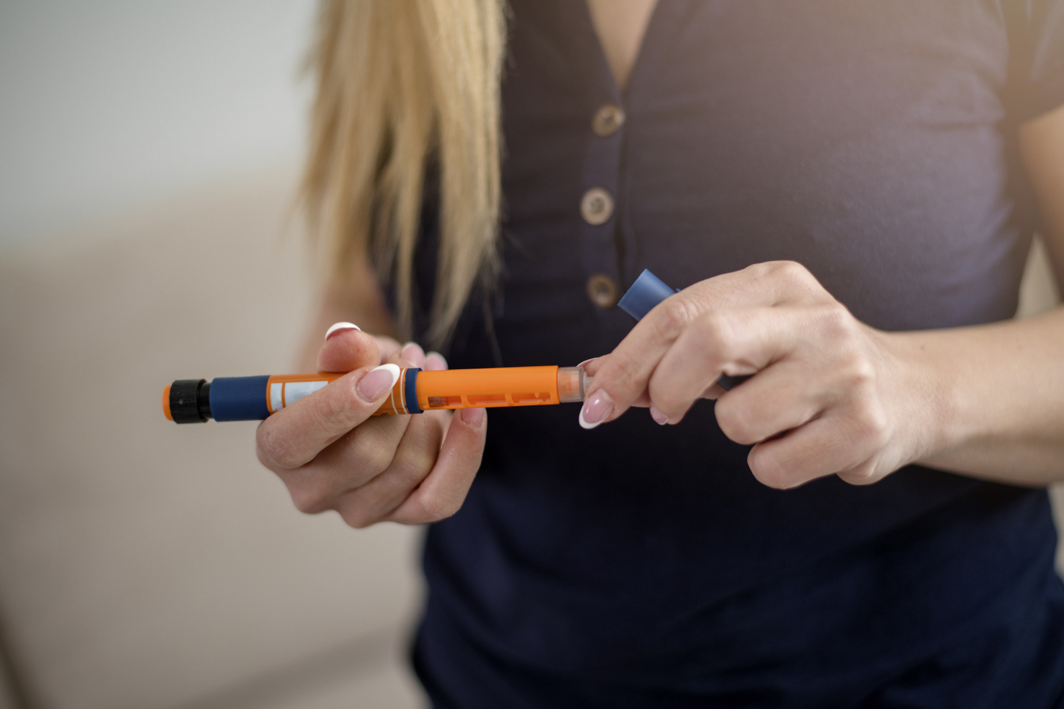 Woman holding insulin pen